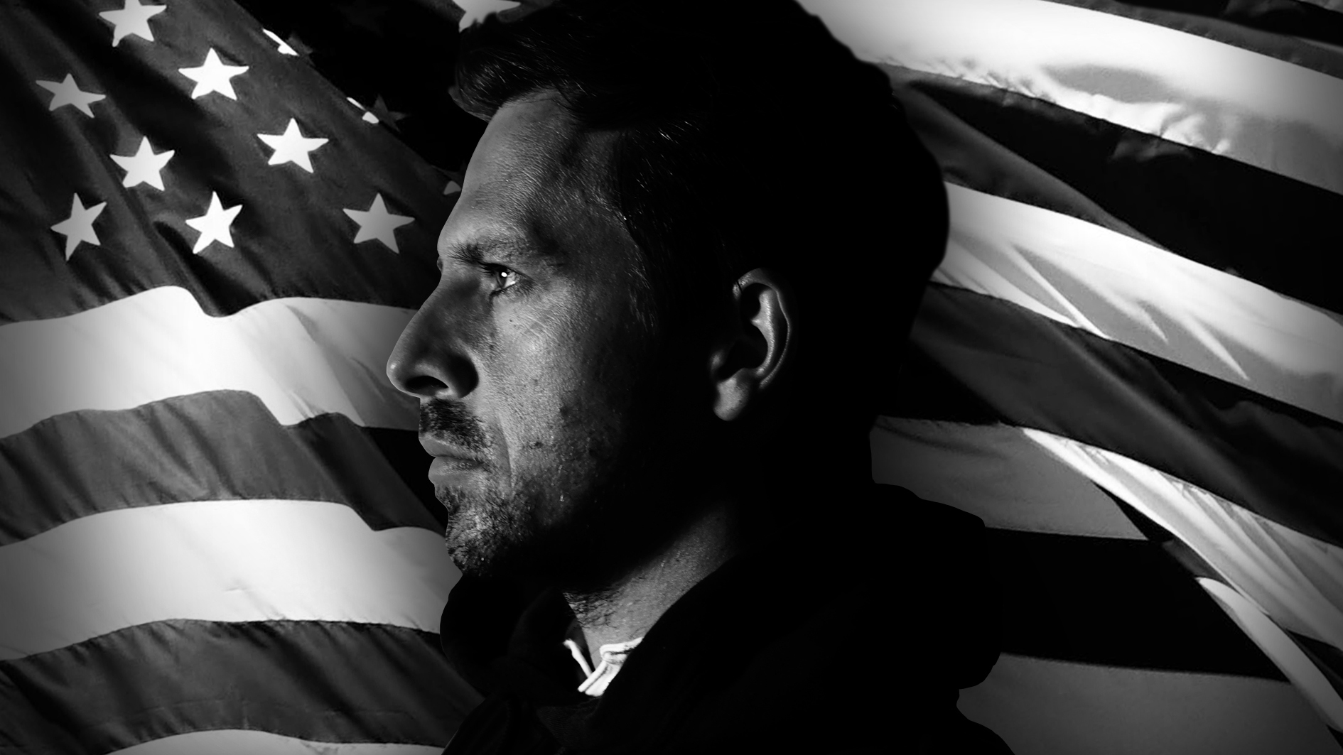 A silhouette of Gerard Doolan against a backdrop of the American flag in black and white