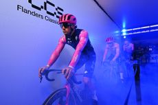 Man cycles indoors with smoke machine