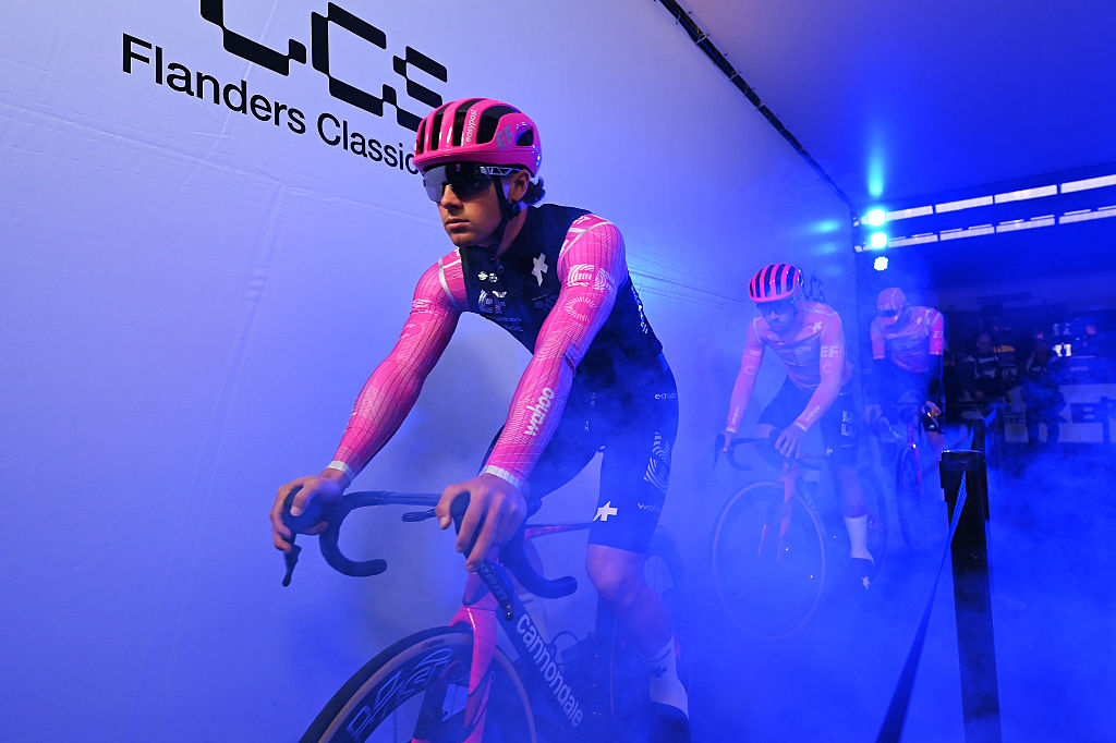 Man cycles indoors with smoke machine