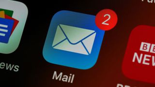 close-up of an iCloud email icon on a smartphone