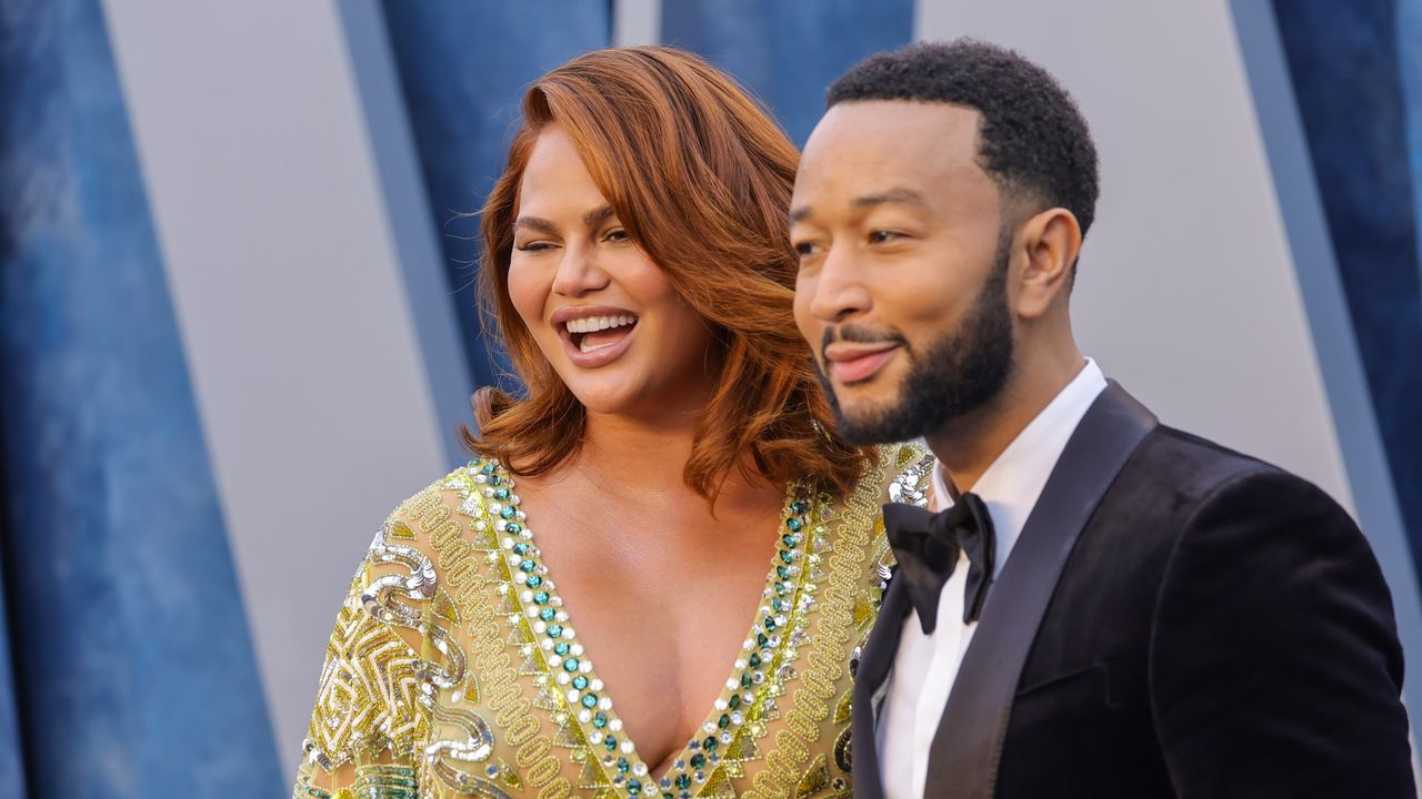 Chrissy Teigen and John Legend at an event