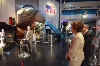 — Scott Hartwig, president and CEO of United Space Alliance (USA), speaks at his company's space shuttle pin presentation ceremony as Ellen Ochoa, NASA Johnson Space Center director, and Richard Allen, Space Center Houston president and CEO, look on, June 18, 2014