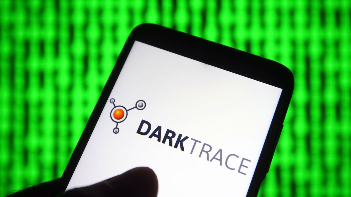 Darktrace logo on a smartphone