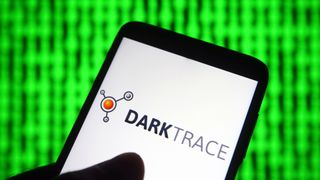Darktrace logo on a smartphone