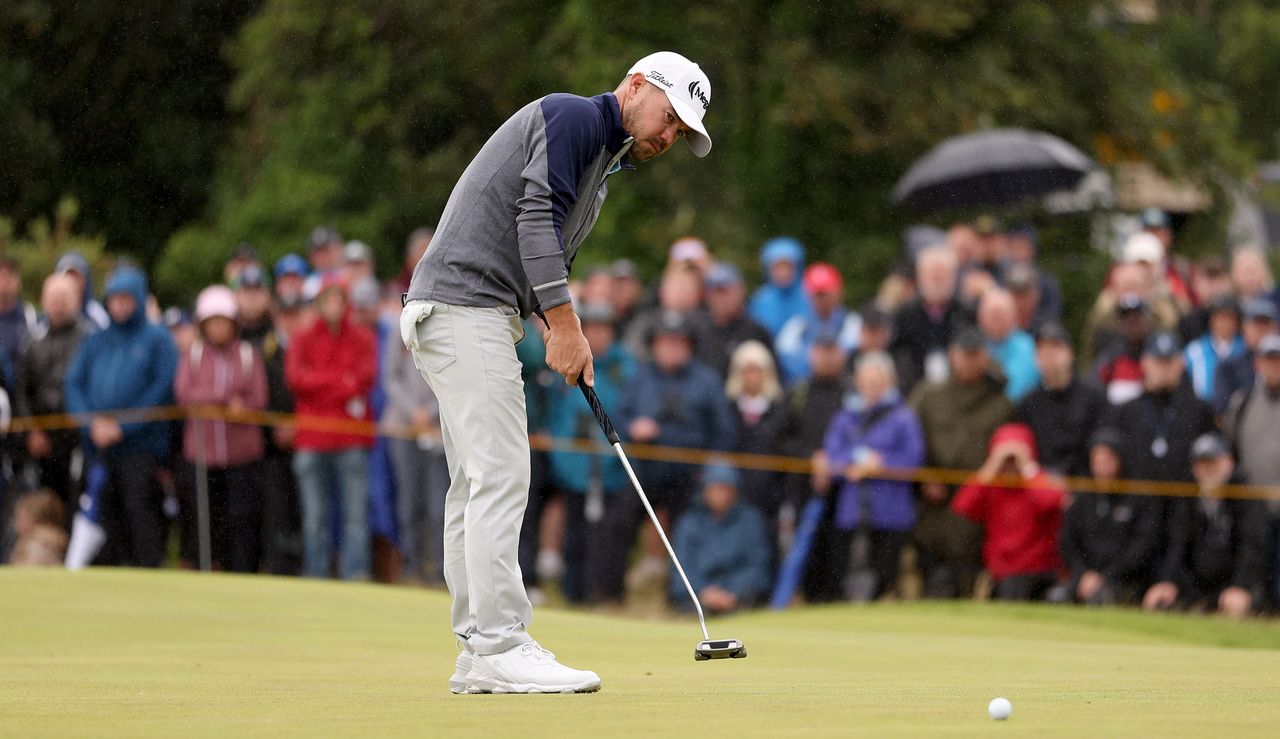 Brian Harman hits a putt at The Open