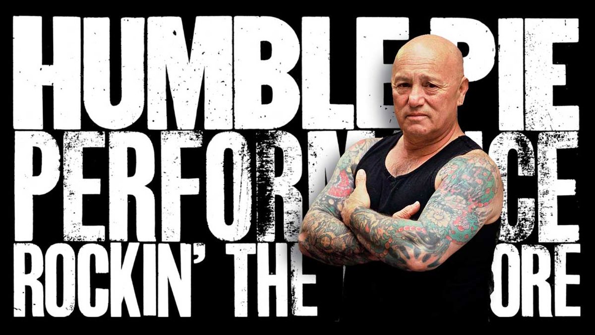 Angry Anderson standing in front of the artwork for Humble Pie&#039;s Performance: Rockin&#039; The Fillmore