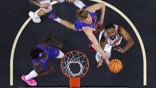 Thomas Haugh of the Florida Gators rebounds the ball against J'Wan Roberts of the Houston Cougars during the 2025 college basketball national championship game