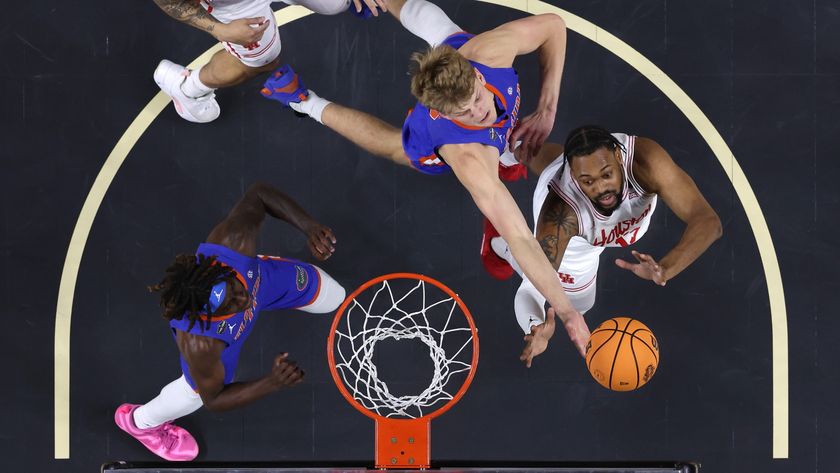 Thomas Haugh of the Florida Gators rebounds the ball against J&#039;Wan Roberts of the Houston Cougars during the 2025 college basketball national championship game