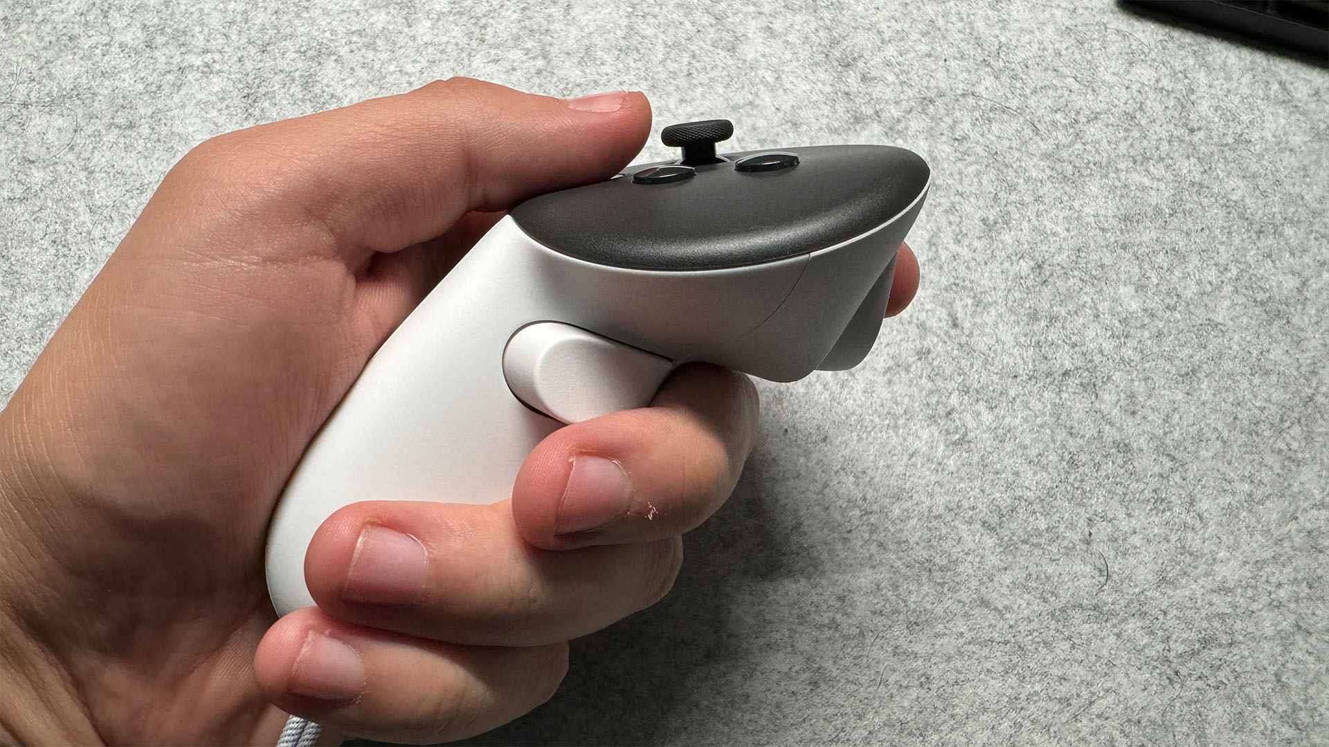 Meta Quest 3 controller in a reviewer's hand