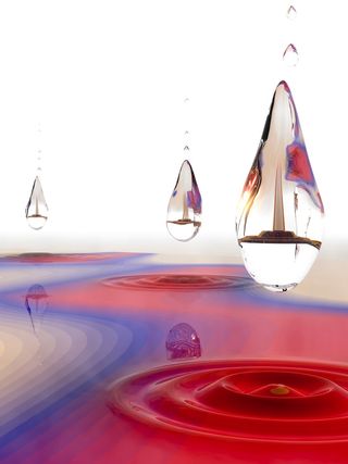 A Dropleton is a new kind of stable particle cluster in solids, formed inside a tiny correlation bubble (drops). This liquid-like particle droplet is created by light and its energy (horizontal direction) has quantized dependency on light intensity (vertical direction).