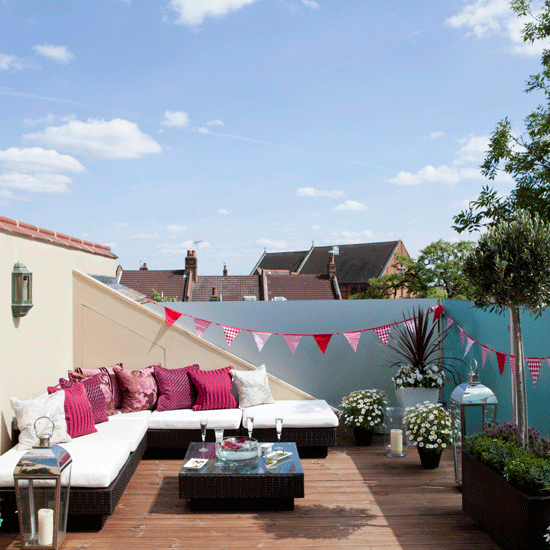 terrace with white sofa and bunting