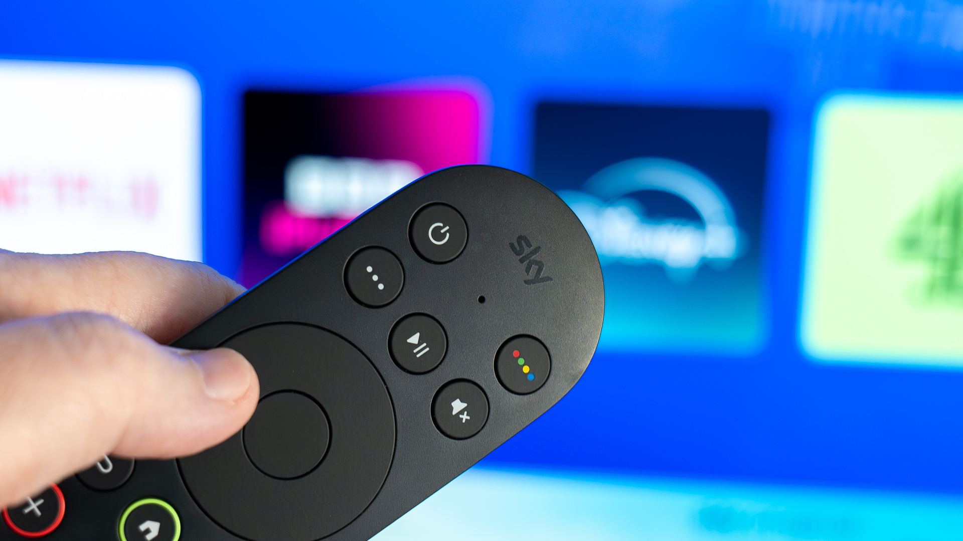 Sky Stream remote control pointing at apps on a TV