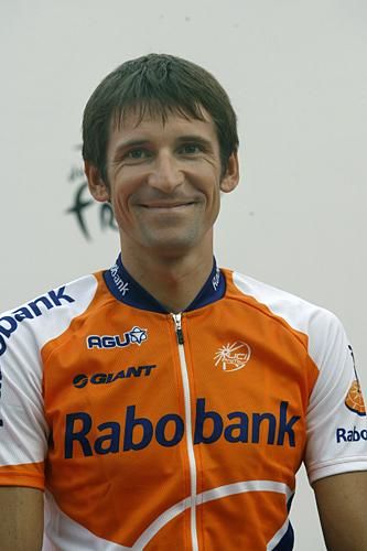 A smiling Denis Menchov is acknowledged as Rabobank is presented.
