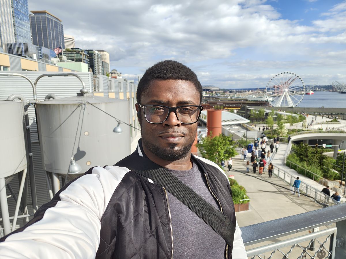 A selfie with a Ferris wheel in the background