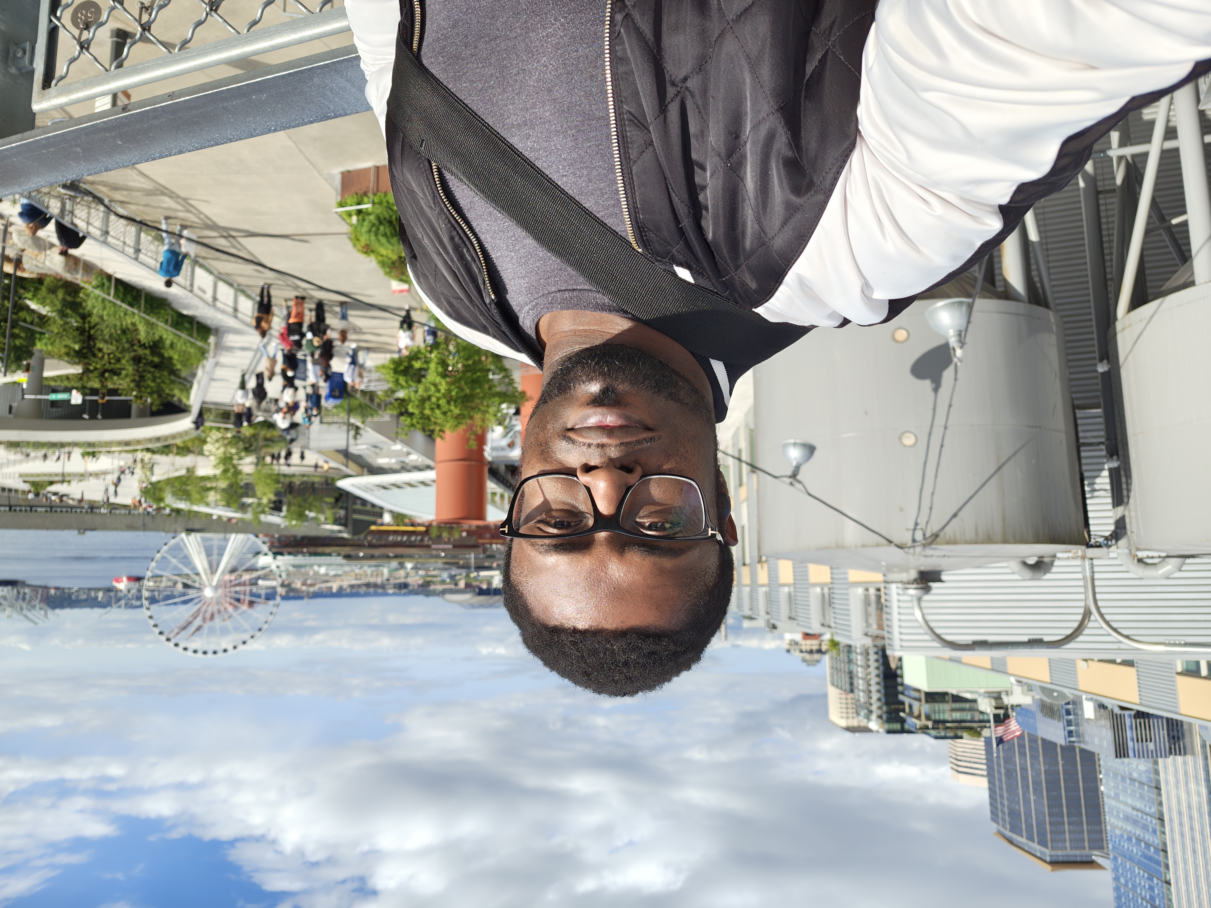 A selfie with a Ferris wheel in the background