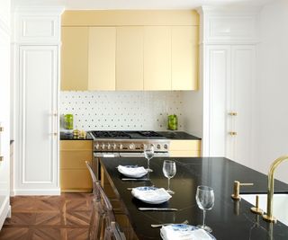 Kitchen with gold backsplash