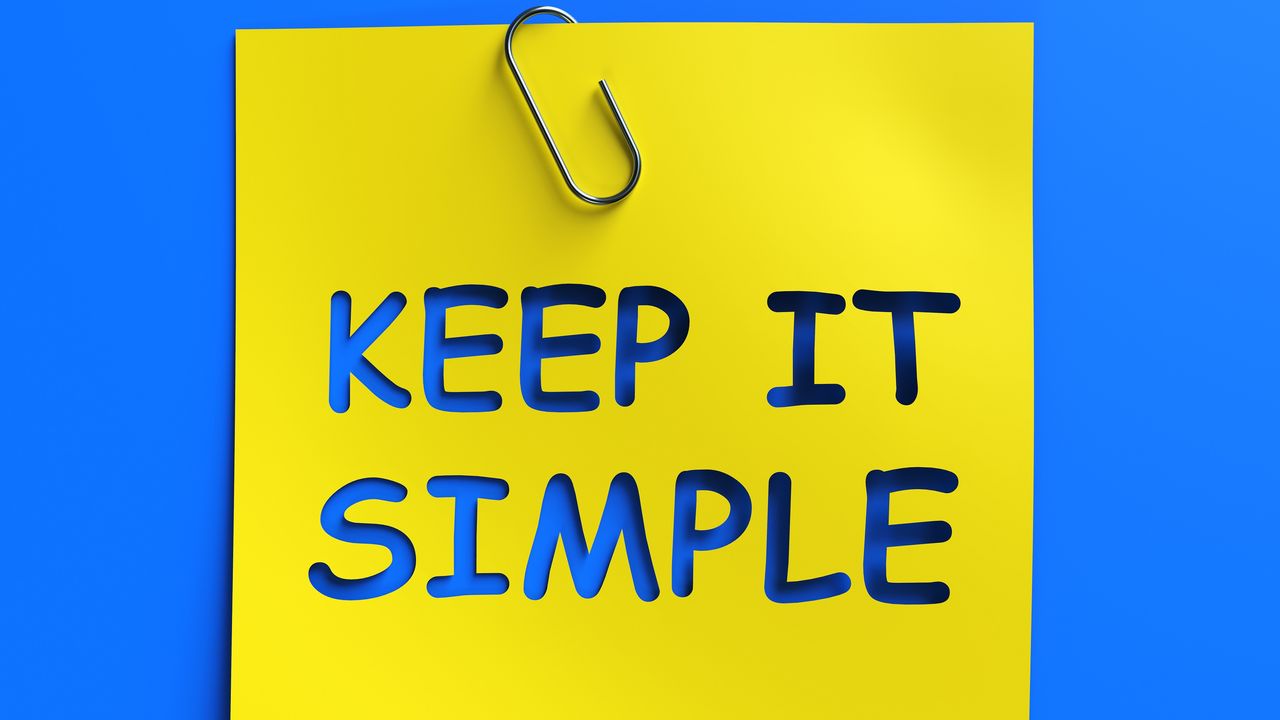 A yellow sticky note says Keep It Simple, against a blue background.