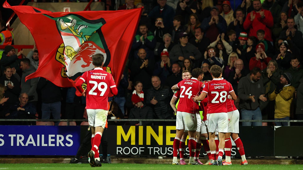 Nathan Broadhead of Wrexham celebrates after he scores his sides first goal during the Carabao Cup Third Round match between Wrexham and Reading at Racecourse Ground on September 23, 2025 in Wrexham, Wales