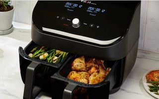 The Instant Vortex Plus Dual Drawer air fryer with food in both baskets