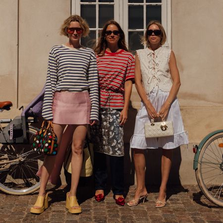 woman wearing a striped shirt and a pink skirt, woman wearing a striped shirt and a floral skirt, woman wearing a white top and a white skirt,