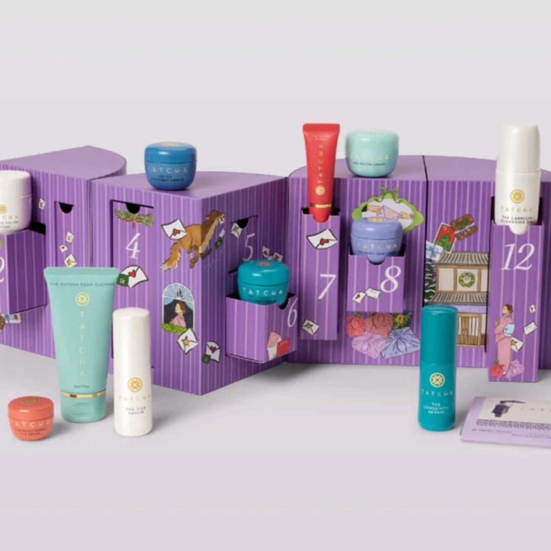 Tatcha 12 Ways To Love Your Skin Advent Calendar ith its contents in front of it