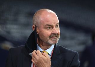 Steve Clarke removes his face covering