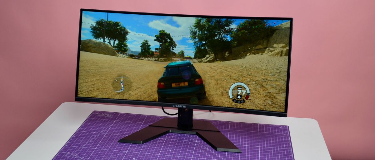 A Gigabyte GS34WQC gaming monitor on a desk