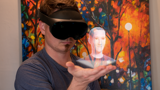 Holding a hologram of Mark Zuckerberg while wearing a Meta Quest Pro headset