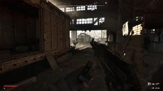 Skif reloading an assault rifle in Stalker 2: Shadow of Chornobyl