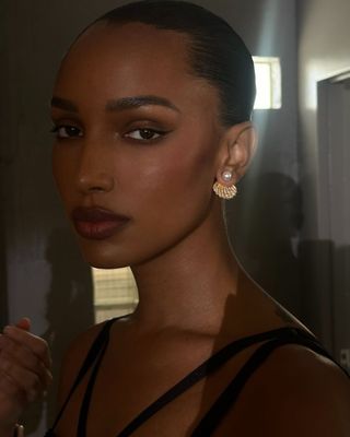 Jasmine Tookes with brown-toned makeup