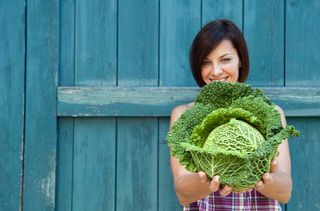 Woman holding a cabbage