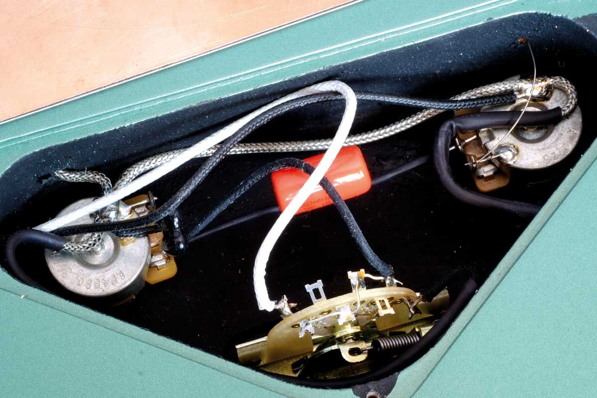 Controls are simple and the circuit is tidy. The pots are valued at 300kohms and there&rsquo;s a TAD treble bleed, a 250 picofarads silver mica capacitor, and a large 660V .022 microfarads Tube Amp Doctor (TAD) Sprague &lsquo;orange drop&rsquo; tone capacitor.
