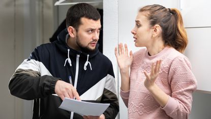 A landlord appears to be putting a young woman on the spot about a lease.