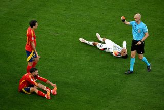 Referee Anthony Taylor shows a red card to Daniel Carvajal of Spain during the UEFA EURO 2024 quarter-final match between Spain and Germany at Stuttgart Arena on July 05, 2024 in Stuttgart, Germany