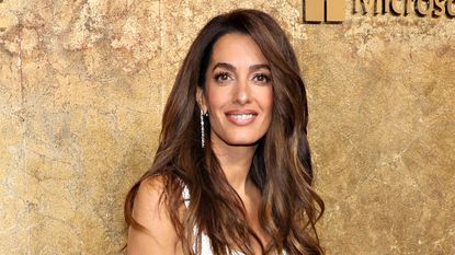 Amal Clooney's white sequin cami dress seen as she attends the Clooney Foundation For Justice's "The Albies"
