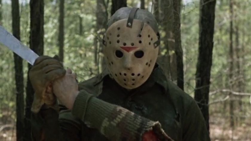 Jason holding machete and dismembered arm in Friday the 13th Part VI: Jason Lives