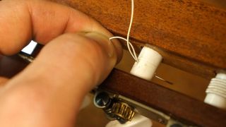 Using the double string method to attach nylon guitar strings