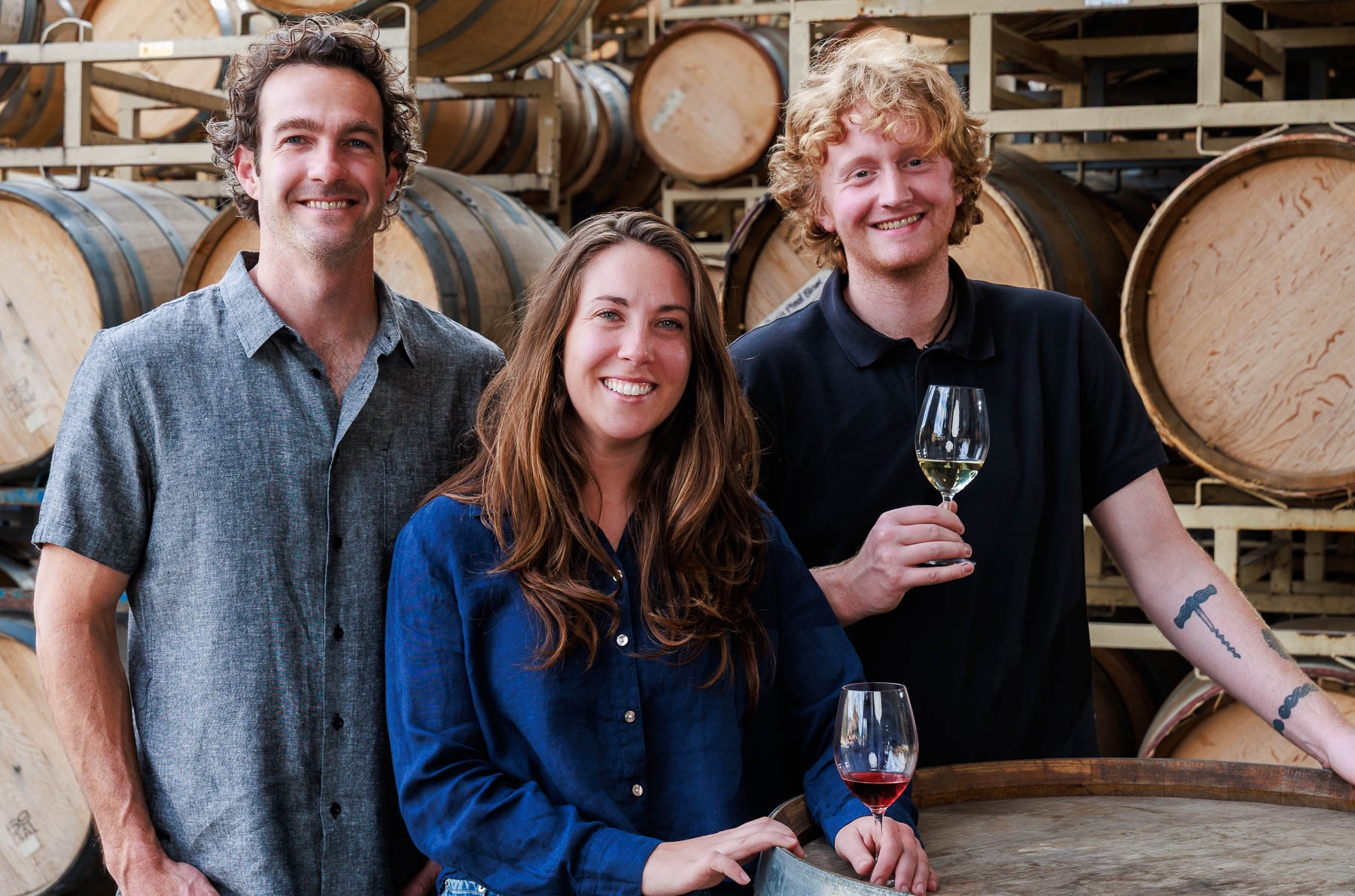 Au Bon Climat winemaker Marc Piro and Sarah Atwood with co-owner Knox Alexander Clendenen in the barrel room