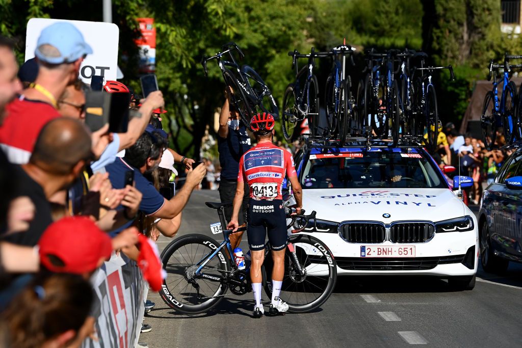 TOMARES SPAIN SEPTEMBER 06 Remco Evenepoel of Belgium and Team QuickStep Alpha Vinyl Red Leader Jersey dropped from the peloton after a mechanical problem in the final kilometres during the 77th Tour of Spain 2022 Stage 16 a 1894km stage from Sanlcar de Barrameda to Tomares LaVuelta22 WorldTour on September 06 2022 in Tomares Spain Photo by Tim de WaeleGetty Images