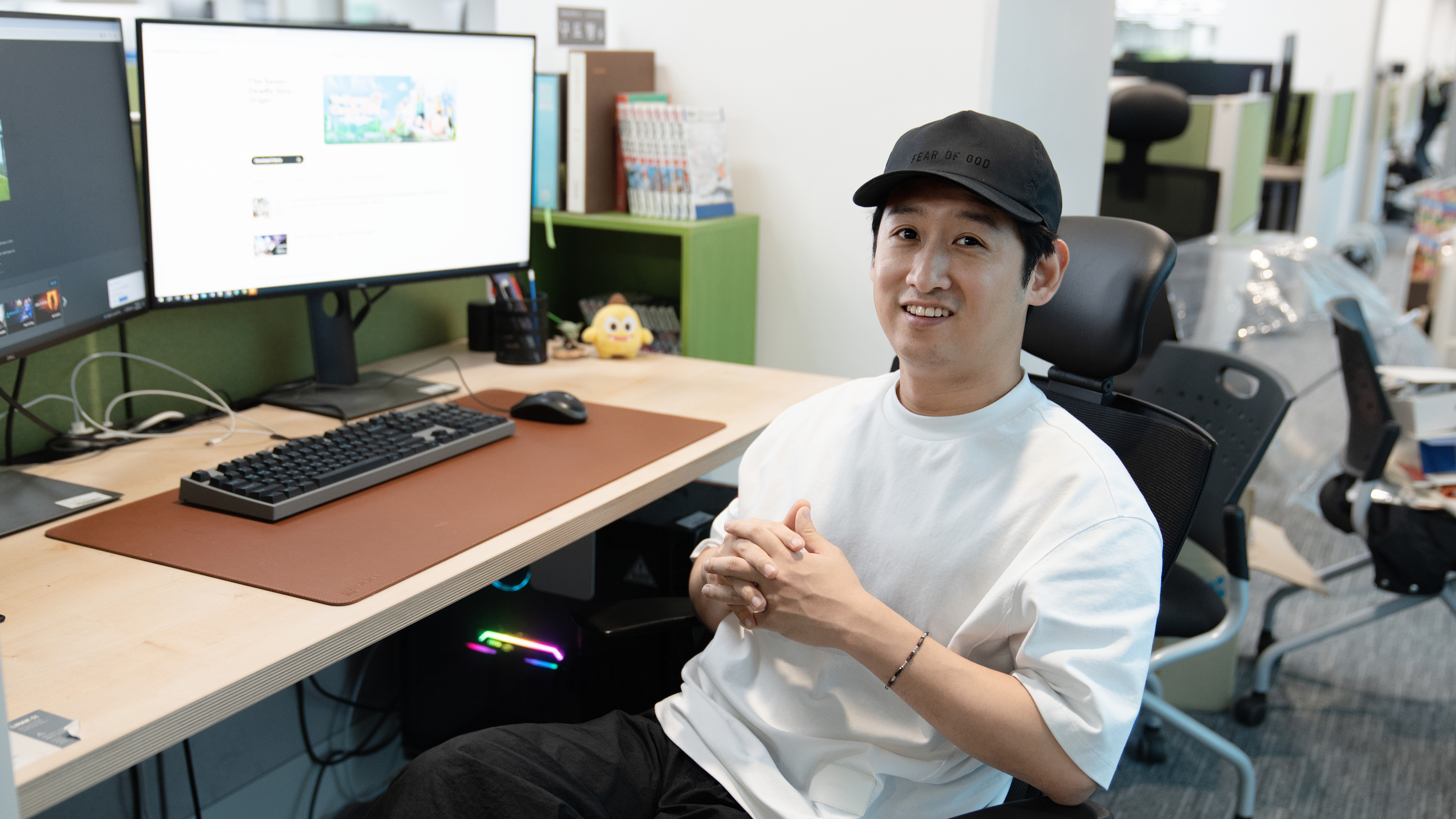 Koo Do Hyung, the Executive Producer of The Seven Deadly Sins Origin, in front of a computer.