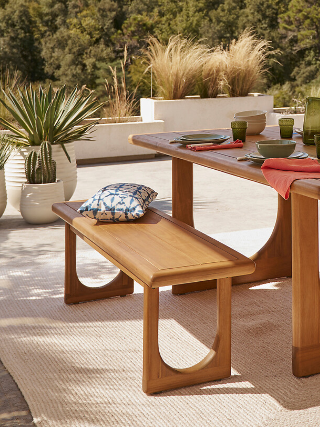 A brown wooden outdoor dining bench from La Redoute