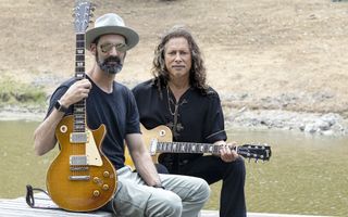 Cesar Gueikian (left) and Kirk Hammett with their respective prized Gibson Les Pauls