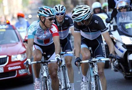 Andy Schleck (Leopard Trek) consults with Philippe Gilbert (Omega-Pharma Lotto) on the road to Ans.