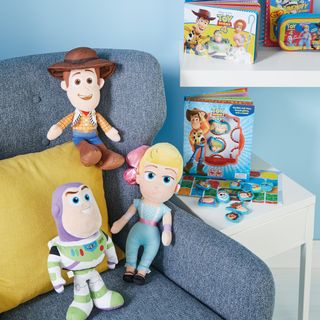 blue sofa and disney toy kids magazine