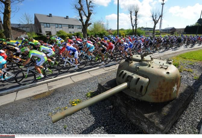 The peloton guarded by a tank