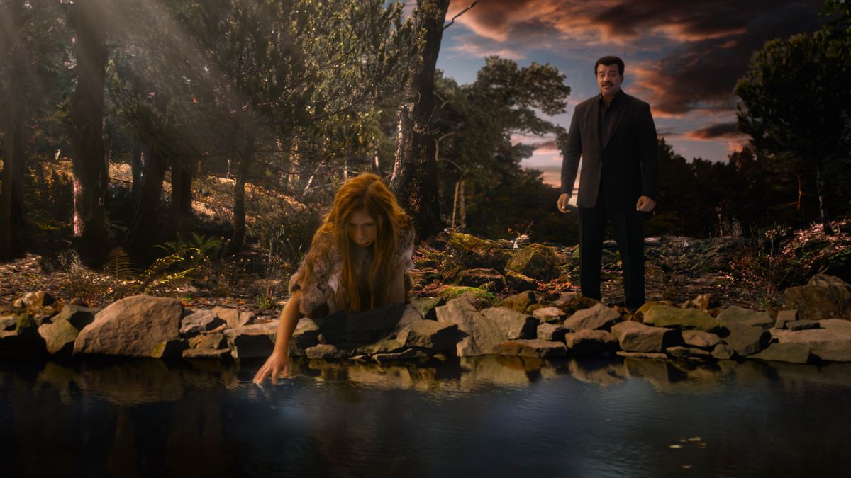 A young Neanderthal girl kneels at the water&#039;s edge as host Neil deGrasse Tyson looks on. Until about 40,000 years ago, our Neanderthal relatives lived very much as we did. 