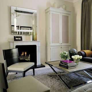 living room with cream wall and fireplace