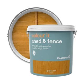 Round bucket of fence stain with circle to show off the colour of the stain in the background