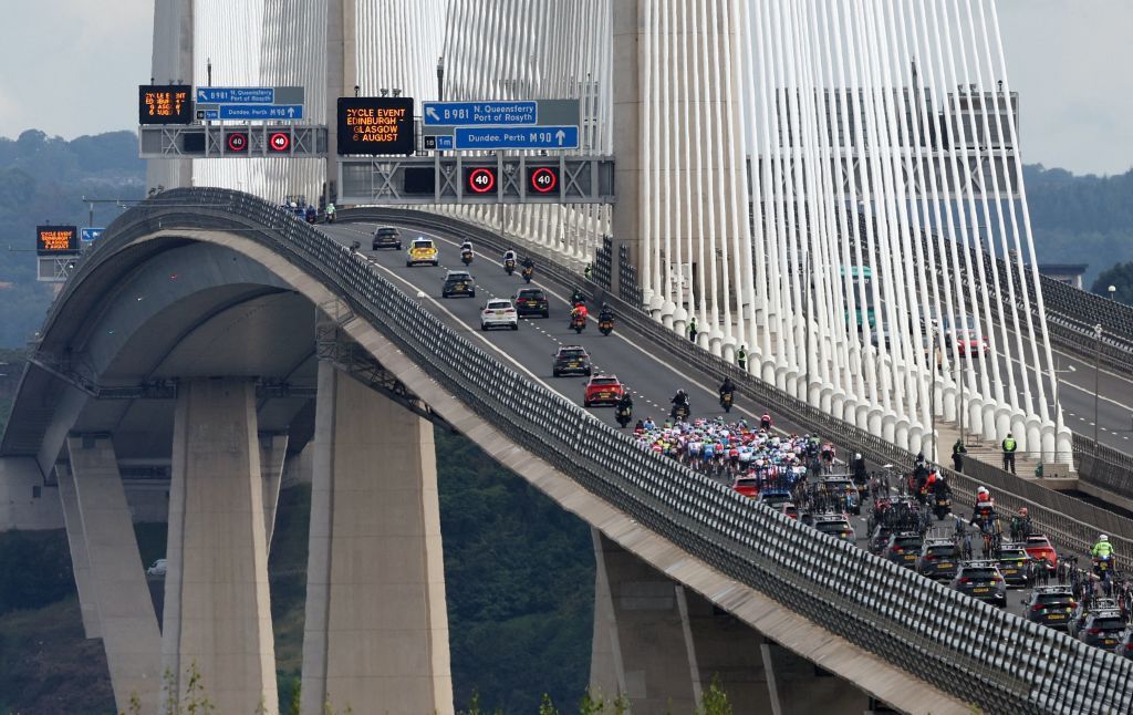 The riders cross The Queensferry Crossing across the Firth of Forth during the mens Elite Road Race at the Cycling World Championships in Edinburgh Scotland on August 6 2023 Photo by Adrian DENNIS AFP Photo by ADRIAN DENNISAFP via Getty Images