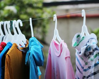 laundry hung up on a clothesline from hangers